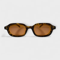 Tortoiseshell oval sunglasses for men and women with brown UV protection lenses